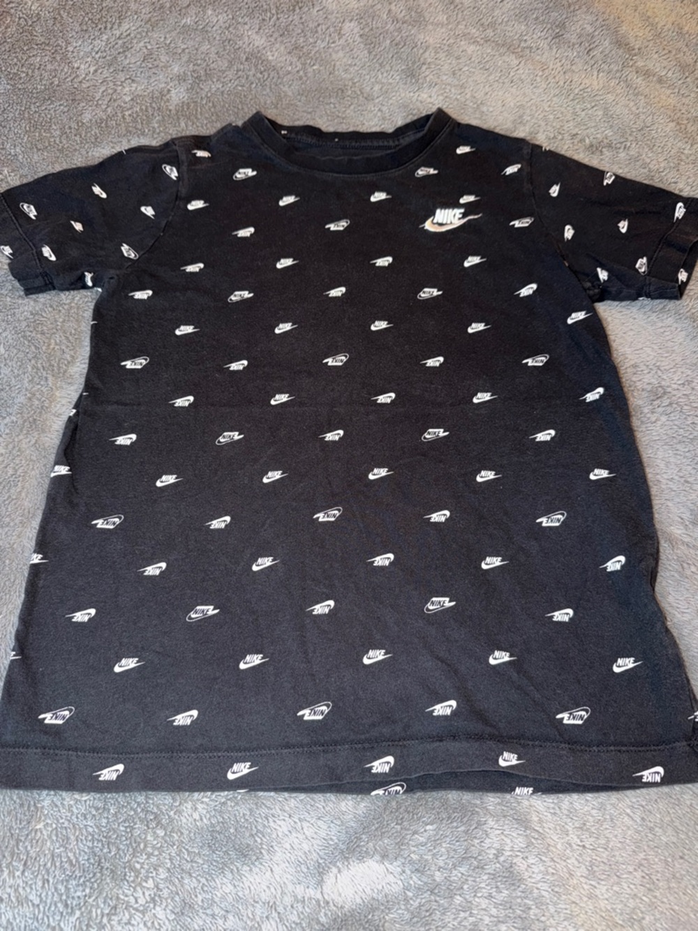 Nike Black T-Shirt with White Mini Swoosh Pattern